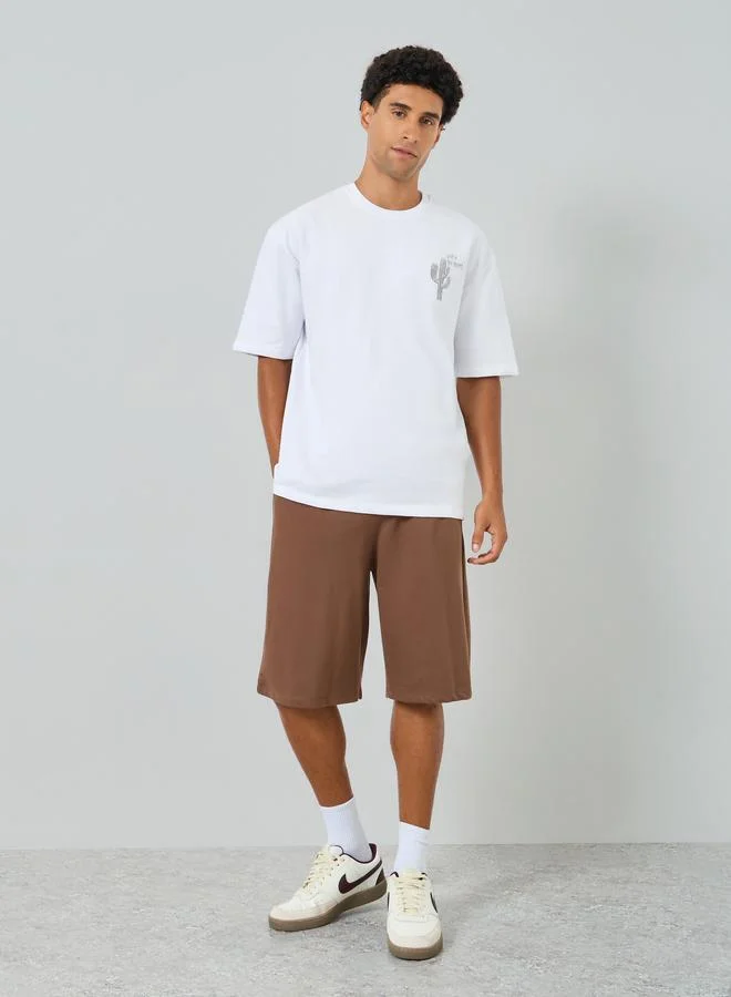 Styli Men Graphic Oversized T-Shirt and Shorts Co-Ords